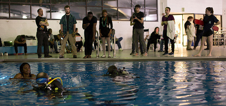 Students work with an underwater cinematographer to capture a scene in the Mason Film Lab. Photo: William Dickson