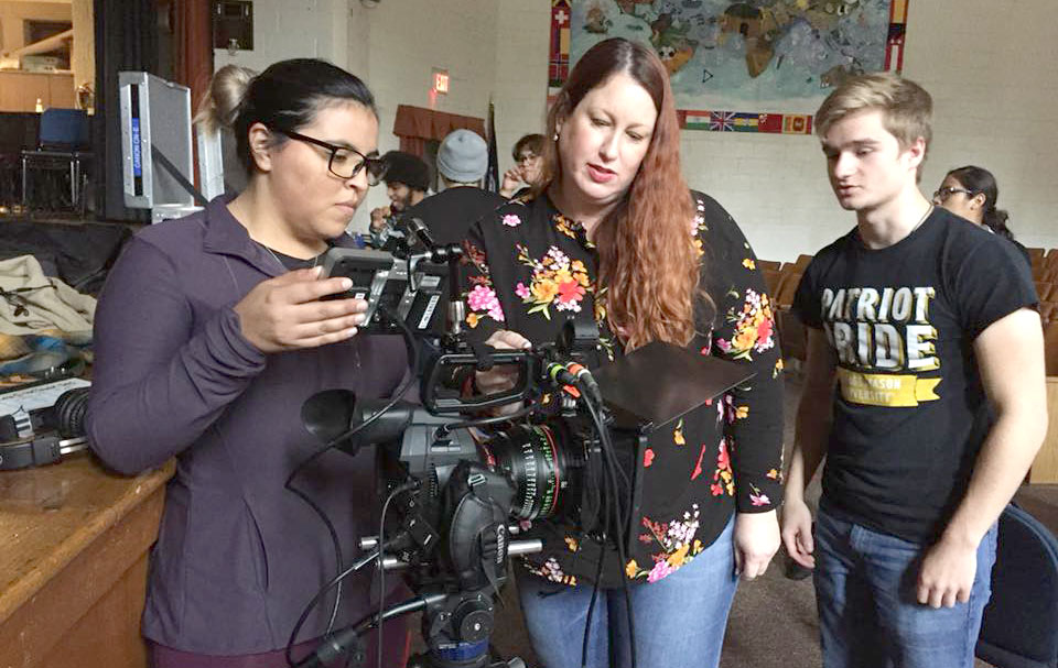 Professor Amanda Kraus and students on set of the Mason Film Lab.